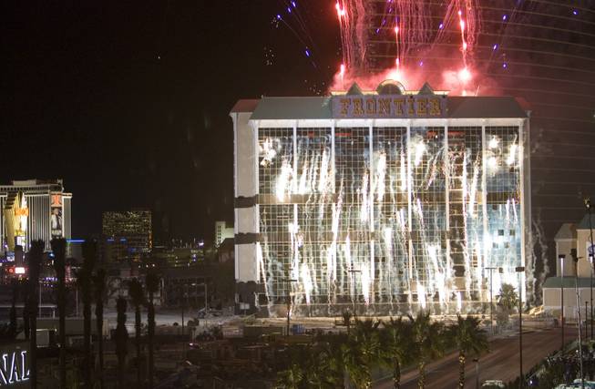 Fireworks explode before the implosion of the New Frontier hotel tower in Las Vegas, Nevada November 13, 2007. The casino on The Las Vegas Strip was purchased by Elad properties, an Israeli-owned real estate investment group, for more than U.S. $1.2 billion in May 2007. Elad Group, which also owns the Plaza hotel in New York, and the IDB Group are expected to build a Plaza-themed, multi-billion dollar megaresort on the site.